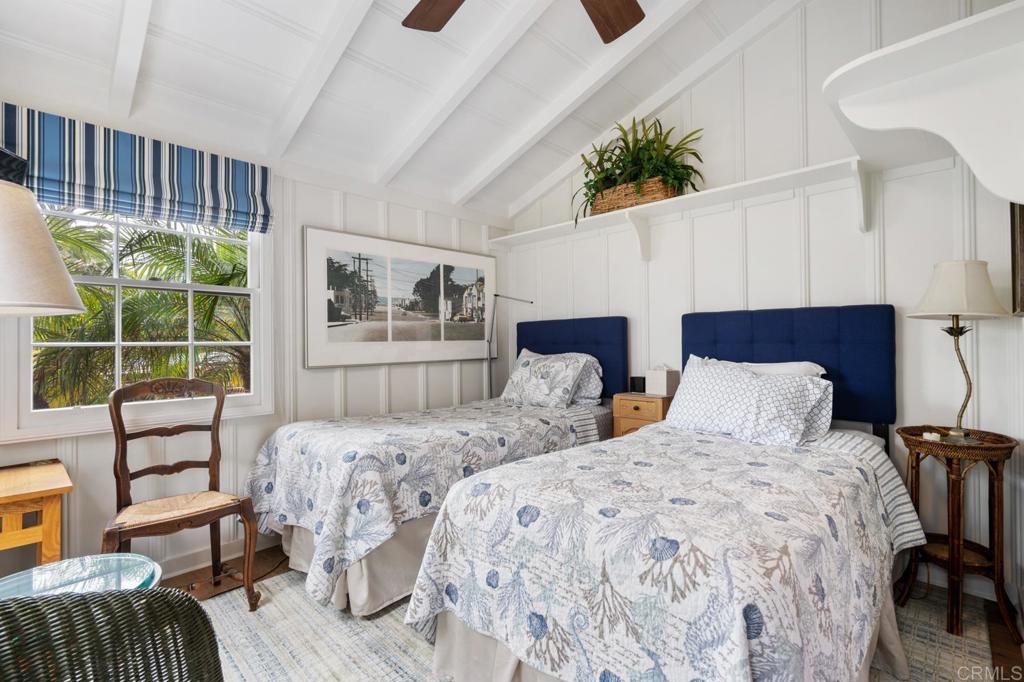 2028 Ocean Front Del Mar, CA 92014 - Photo 26 of 32 a bedroom with two beds and a large window