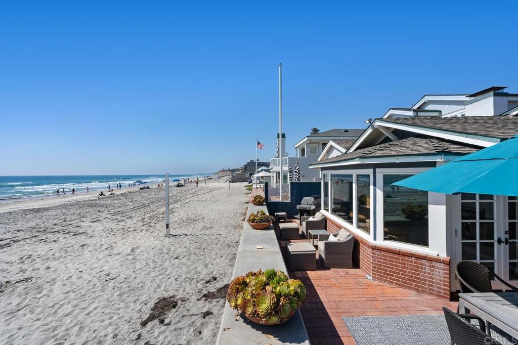 2028 Ocean Front Del Mar, CA 92014 - Photo 3 of 32 a view of a patio with couches chairs and potted plants