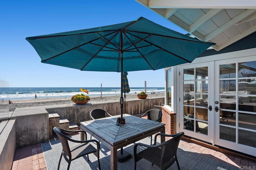 2028 Ocean Front Del Mar, CA 92014 - Photo 4 of 32 a view of an outdoor sitting area with furniture and umbrella