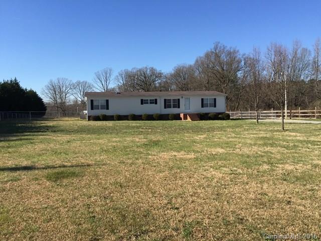 5800 Laney Rogers Road Monroe, NC 28112 - Photo 1 of 21 a view of a house with a yard and trees