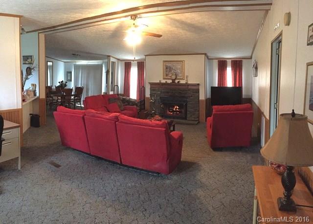 5800 Laney Rogers Road Monroe, NC 28112 - Photo 14 of 21 a living room with furniture and a mirror