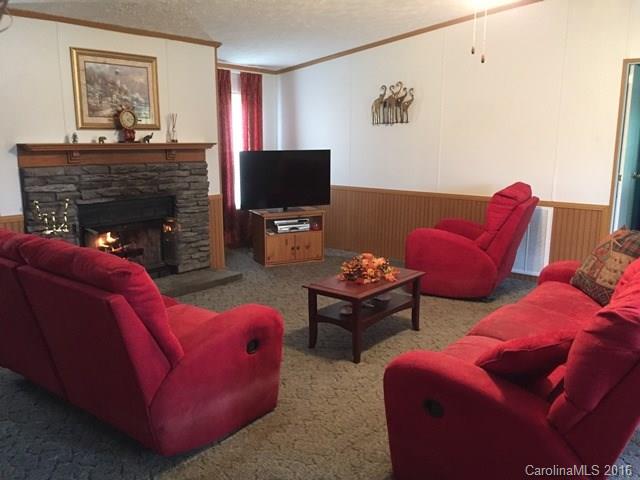 5800 Laney Rogers Road Monroe, NC 28112 - Photo 15 of 21 a living room with furniture and a flat screen tv