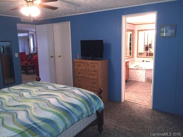 5800 Laney Rogers Road Monroe, NC 28112 - Photo 17 of 21 a bedroom with a bed and a television