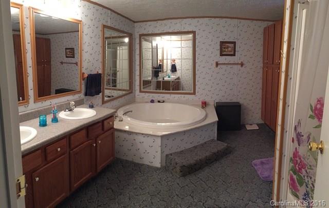 5800 Laney Rogers Road Monroe, NC 28112 - Photo 18 of 21 a spacious bathroom with a tub sink and mirror
