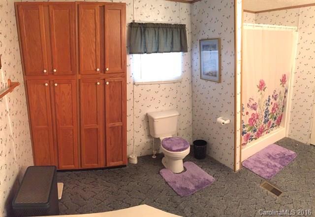 5800 Laney Rogers Road Monroe, NC 28112 - Photo 19 of 21 a bathroom with a toilet and a shower