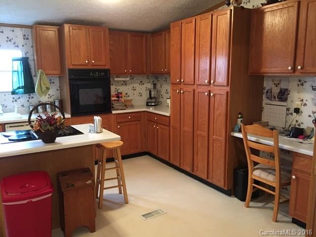 5800 Laney Rogers Road Monroe, NC 28112 - Photo 9 of 21 a kitchen with a sink cabinets and window