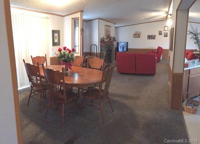 5800 Laney Rogers Road Monroe, NC 28112 - Photo 10 of 21 a dining room with furniture and wooden floor