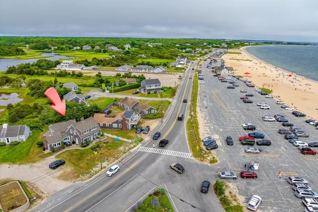 an aerial view of swimming pool with outdoor seating