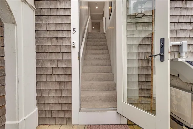 a view of a room with shelves on the wall