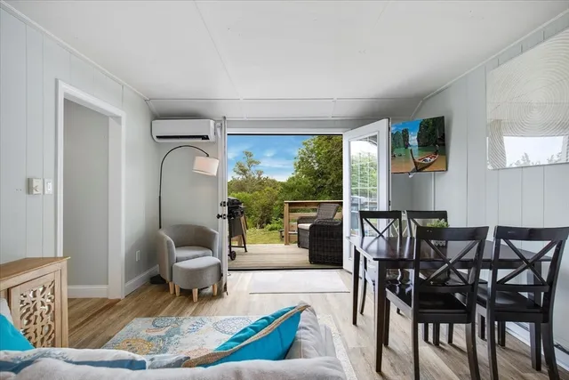 an aerial view of a house with a ocean
