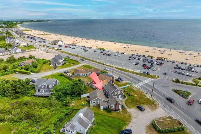 a view of swimming pool with outdoor seating and a garden