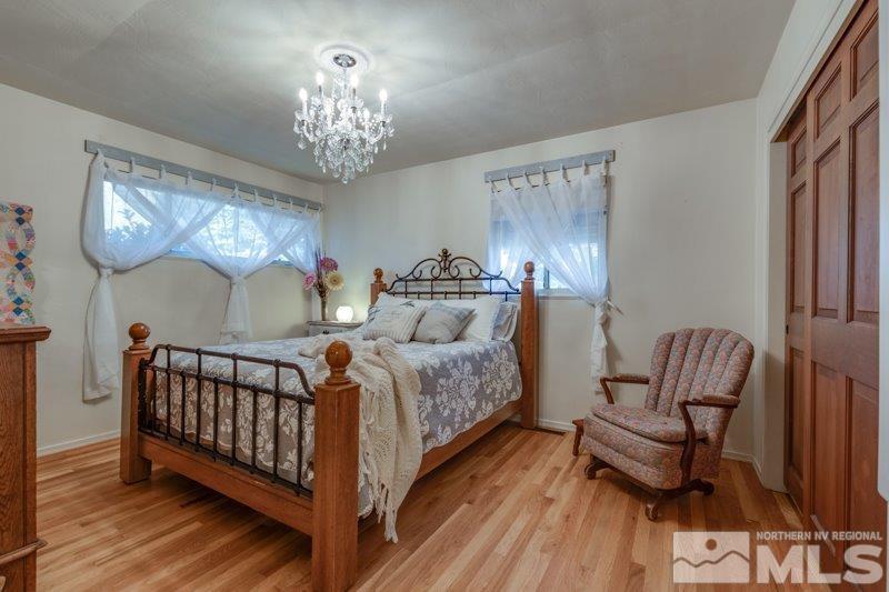 710 West 12th Street Reno, NV 89503 - Photo 13 of 25 a bedroom with furniture and a chandelier