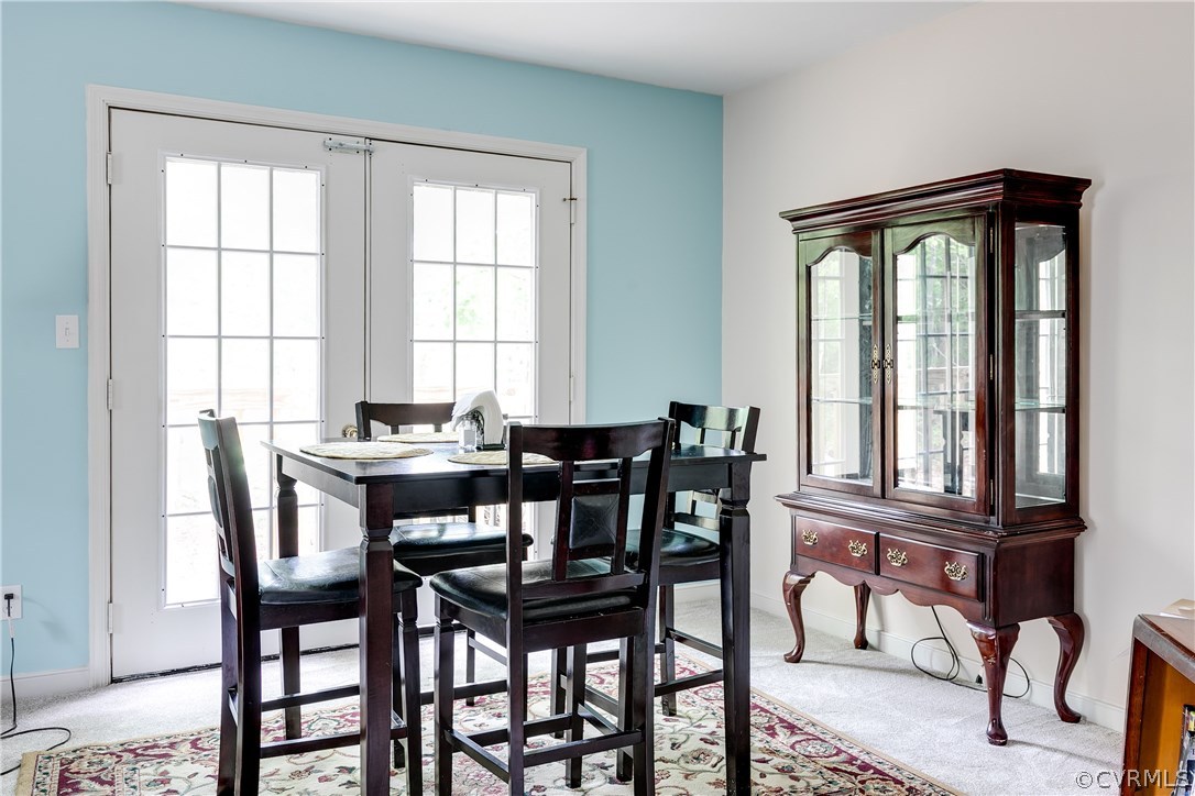 1929 Signboard Road Bumpass, VA 23024 - Photo 8 of 25 a view of a dining room with furniture and windows