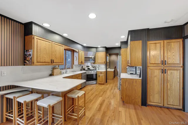 a spacious bedroom with a bed and a lamp with window