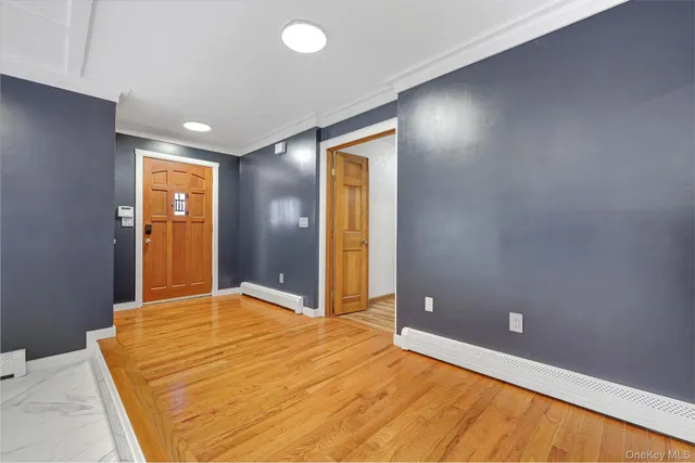 a kitchen with a stove and a white cabinets