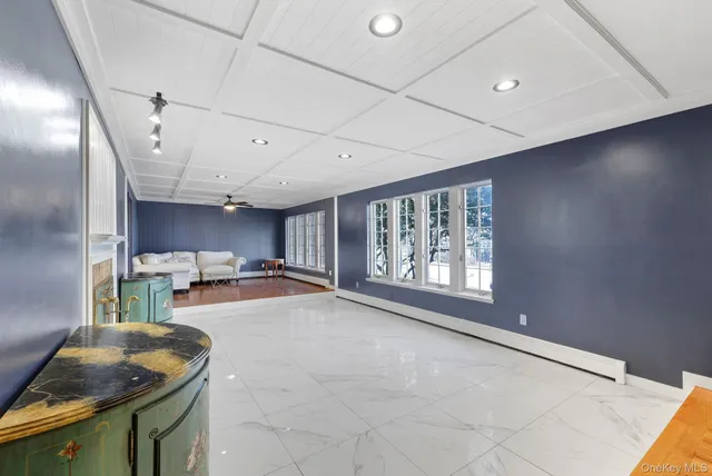 a spacious bedroom with a large bed and a large window