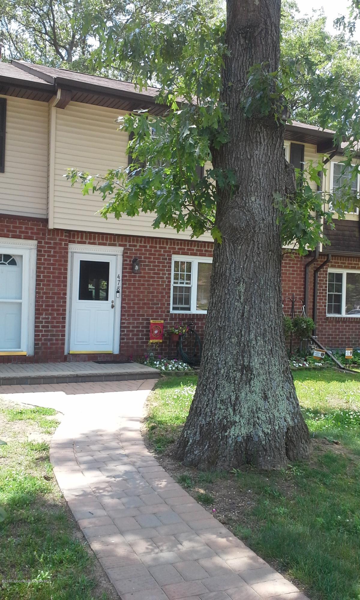 478 Rena Court Brick, NJ 08724 - Photo 1 of 13 a front view of a house with garden