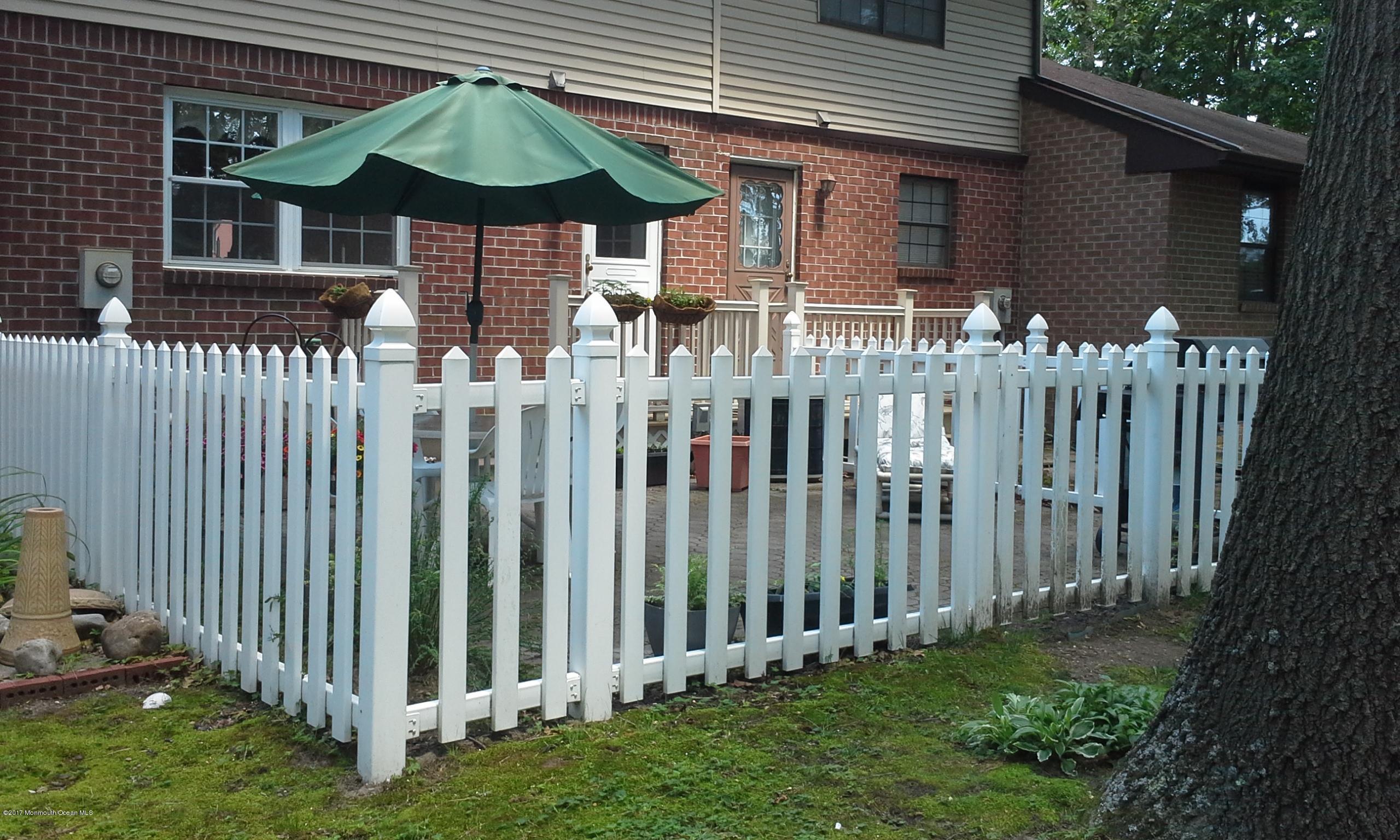 478 Rena Court Brick, NJ 08724 - Photo 12 of 13 a view of small wooden fence with a bench