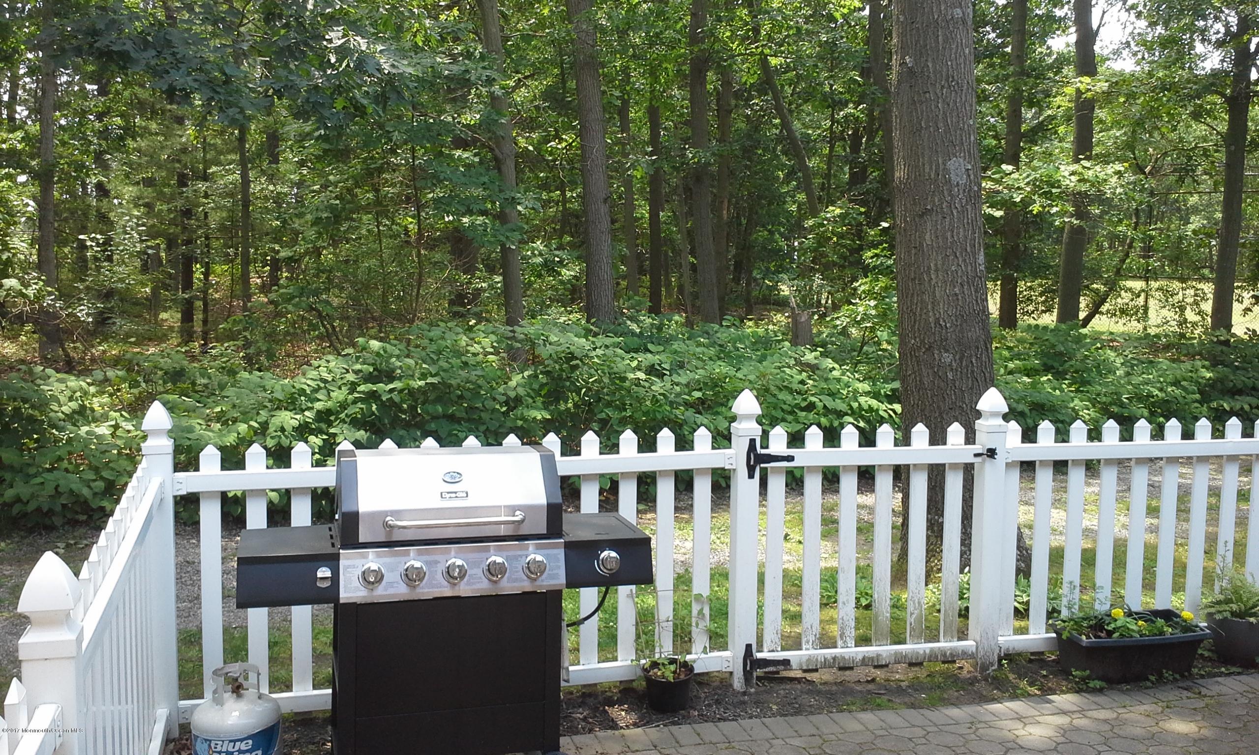 478 Rena Court Brick, NJ 08724 - Photo 13 of 13 a view of a wooden house with a large trees
