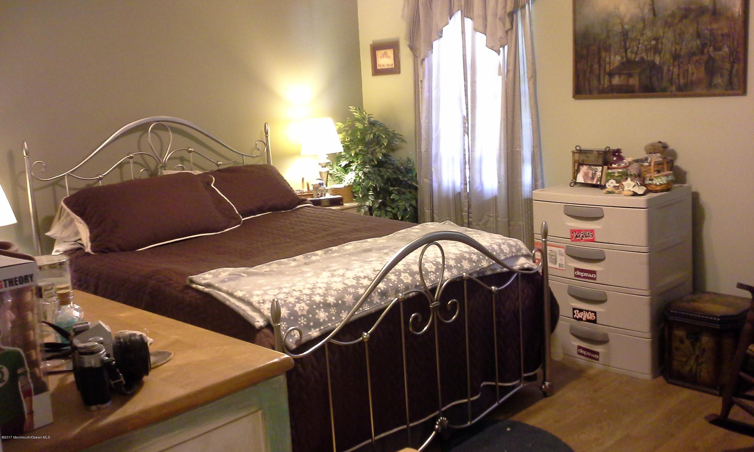 478 Rena Court Brick, NJ 08724 - Photo 8 of 13 a bedroom with a bed and dresser