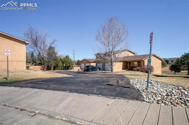 3579 Indigo Ridge Point Colorado Springs, CO 80910 - Photo 30 of 33 Driveway to townhome
