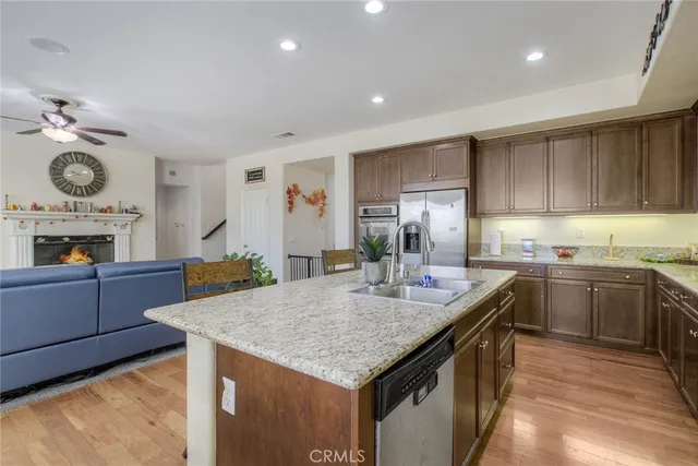 a kitchen with sink cabinets and refrigerator