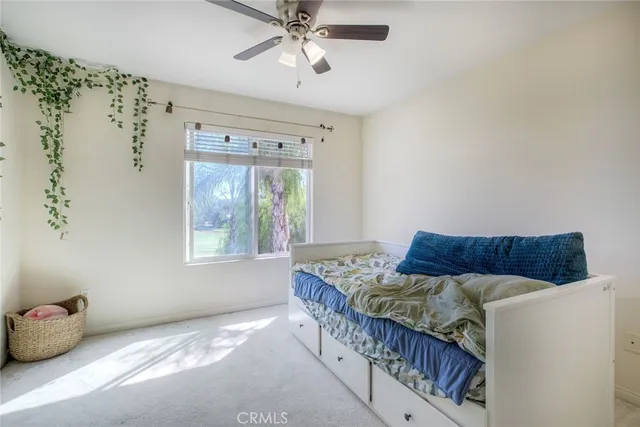 a bedroom with furniture and a window