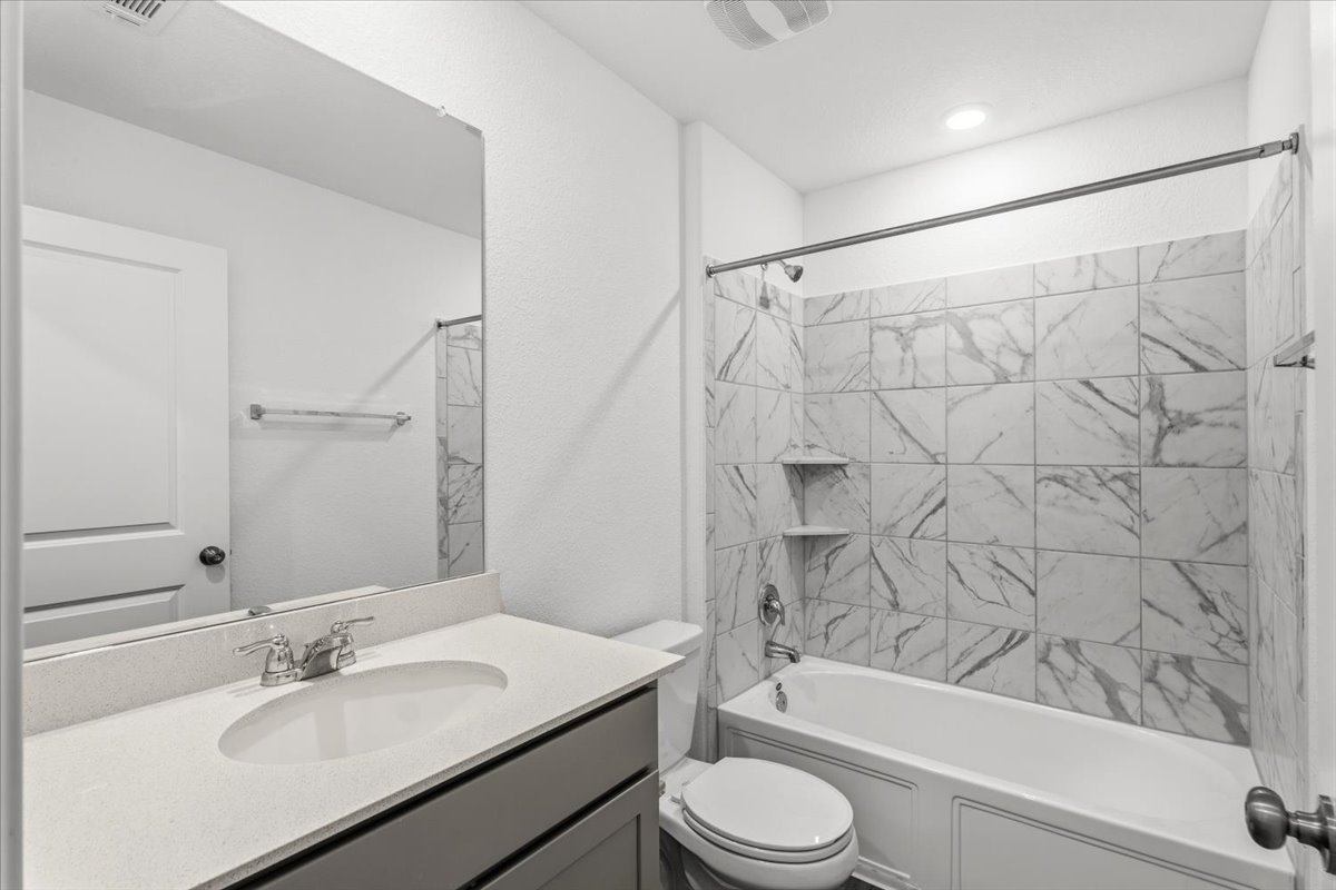 167 Jeffers Kyle, TX 78640 - Photo 16 of 40 Bathroom with vanity and washtub / shower combination