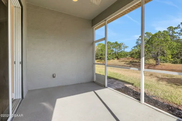 a view of a room with yard from balcony