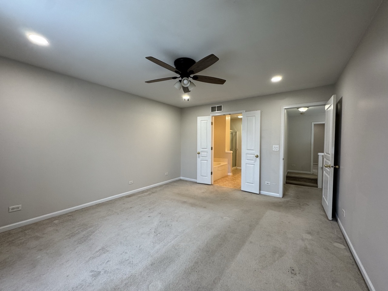 3029 Peachtree Circle Aurora, IL 60502 - Photo 10 of 19 an empty room with a ceiling fan and a window