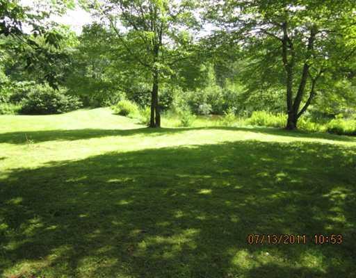 417 Clark Road Prospect, ME 04981 - Photo 12 of 14 Land. Front yard with farm pond.