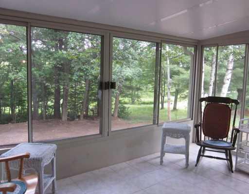 417 Clark Road Prospect, ME 04981 - Photo 4 of 14 Other. Tiled sunroom that looks over...