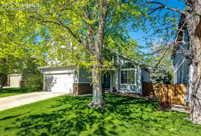 a view of house with yard