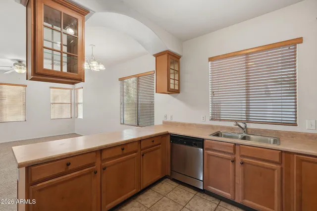 a kitchen with stainless steel appliances granite countertop a refrigerator stove and microwave