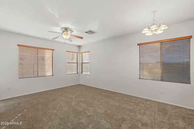 a kitchen with a sink stove top oven and cabinets