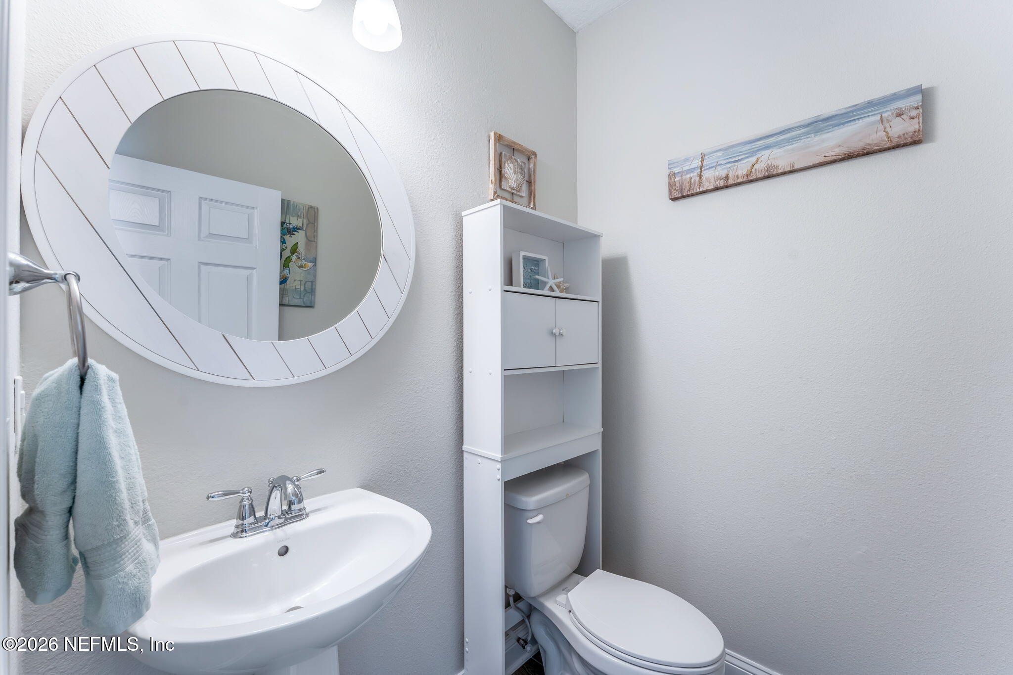 175 Convex Lane St. Augustine, FL 32095 - Photo 12 of 66 a bathroom with a toilet a sink and a mirror