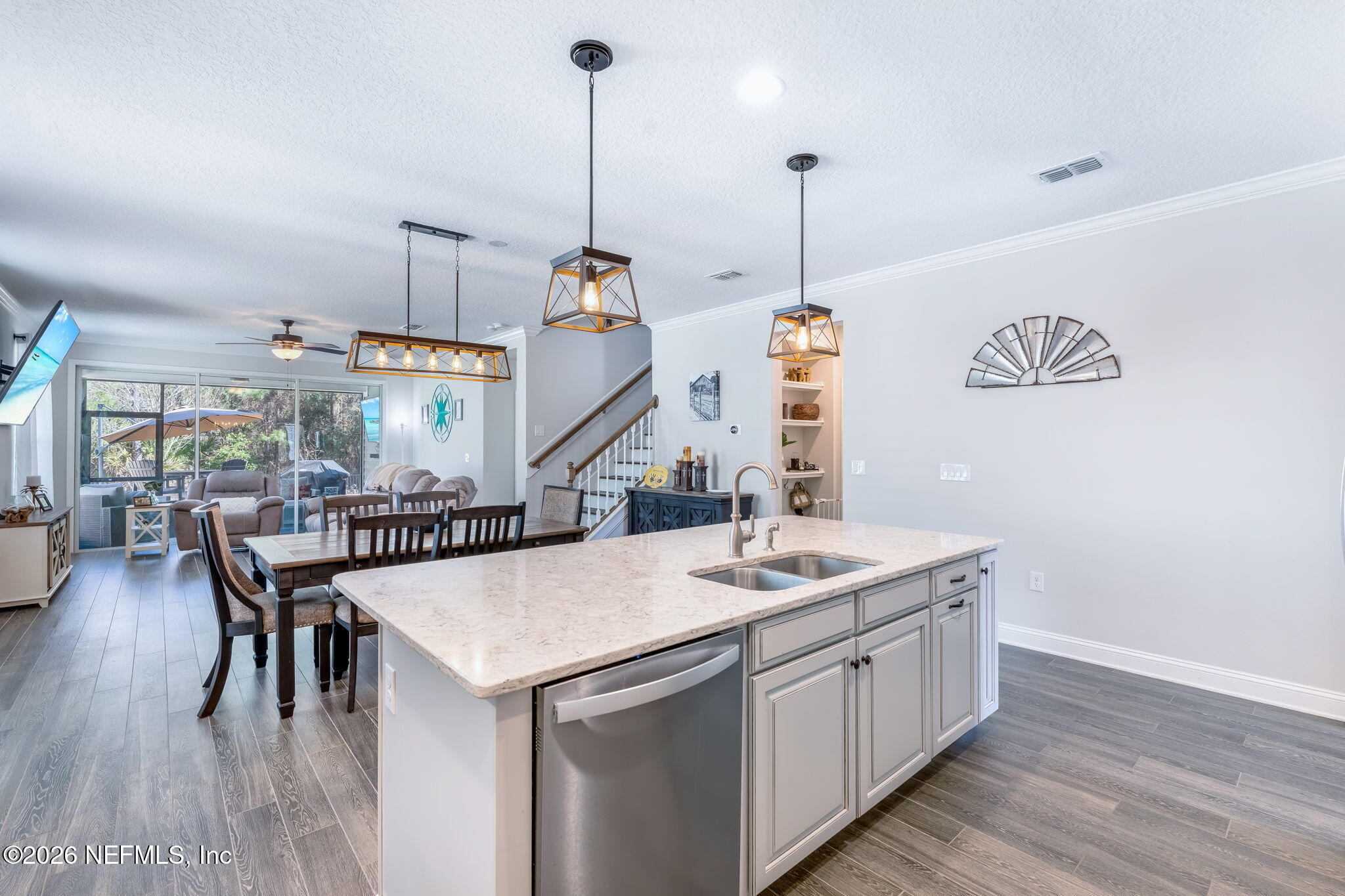175 Convex Lane St. Augustine, FL 32095 - Photo 18 of 66 a kitchen with a sink a counter space and a dining table