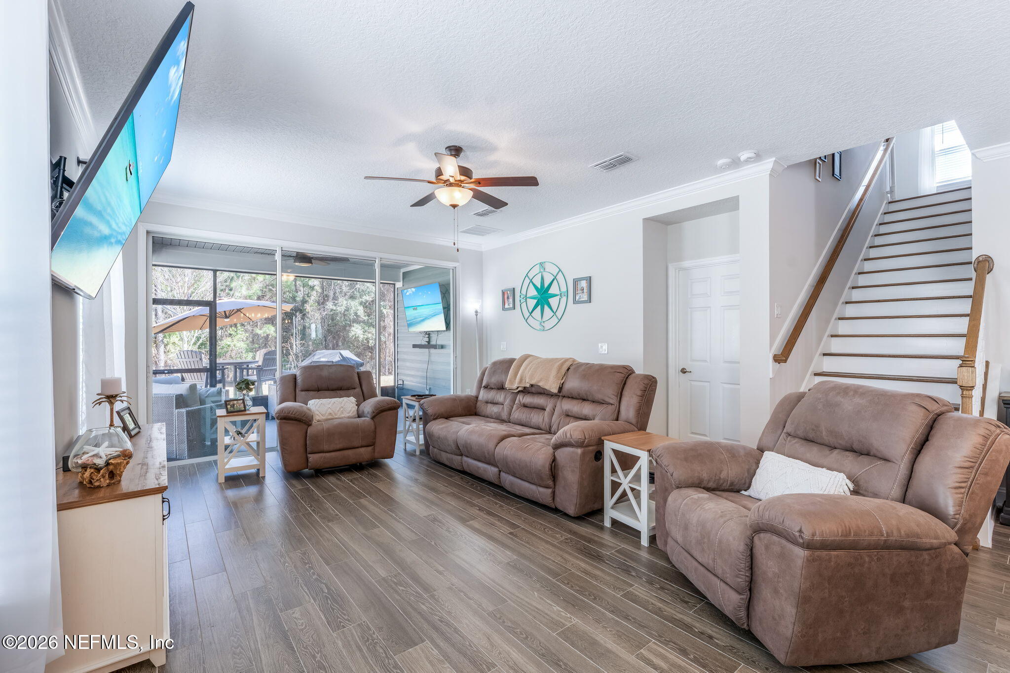 175 Convex Lane St. Augustine, FL 32095 - Photo 22 of 66 a living room with furniture and a large window