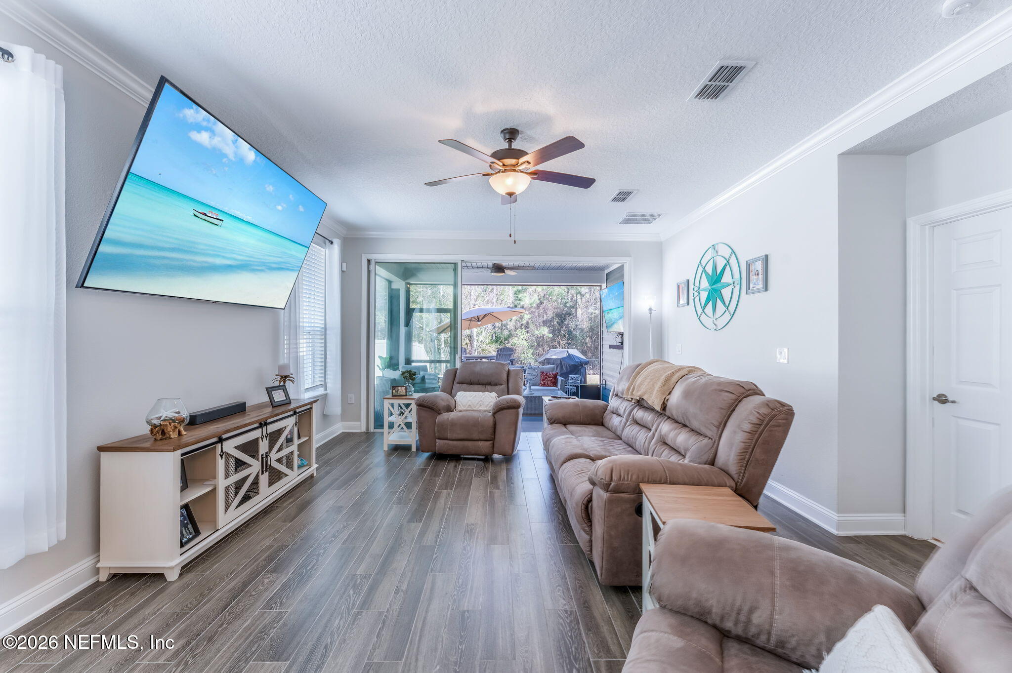 175 Convex Lane St. Augustine, FL 32095 - Photo 23 of 66 a living room with furniture and a large window
