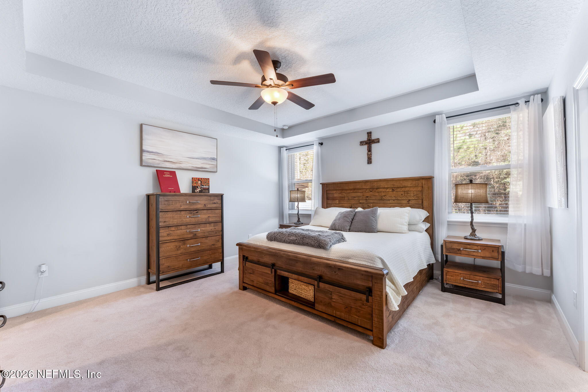 175 Convex Lane St. Augustine, FL 32095 - Photo 28 of 66 a spacious bedroom with a bed and a chandelier