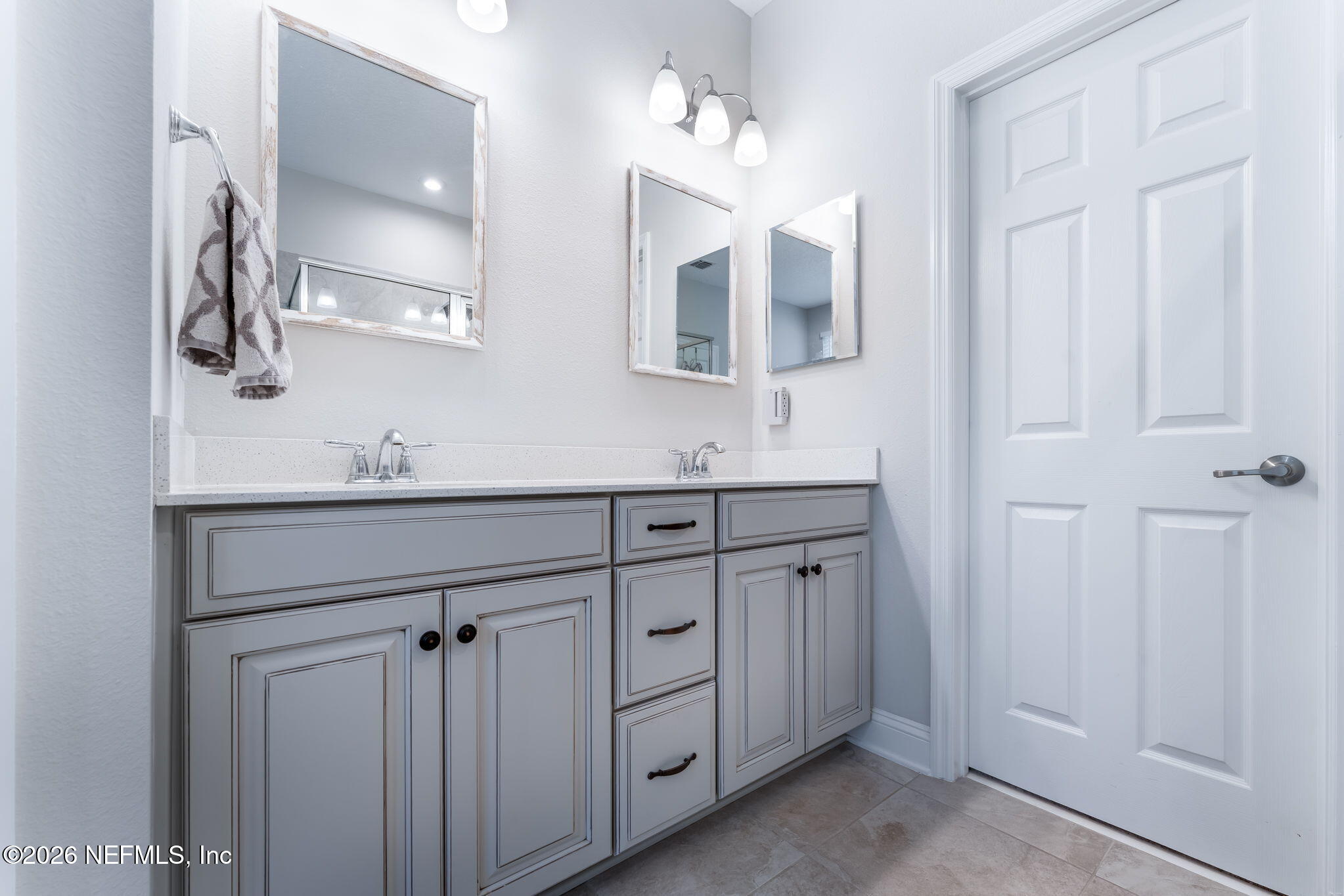 175 Convex Lane St. Augustine, FL 32095 - Photo 31 of 66 a bathroom with a double vanity sink and a mirror