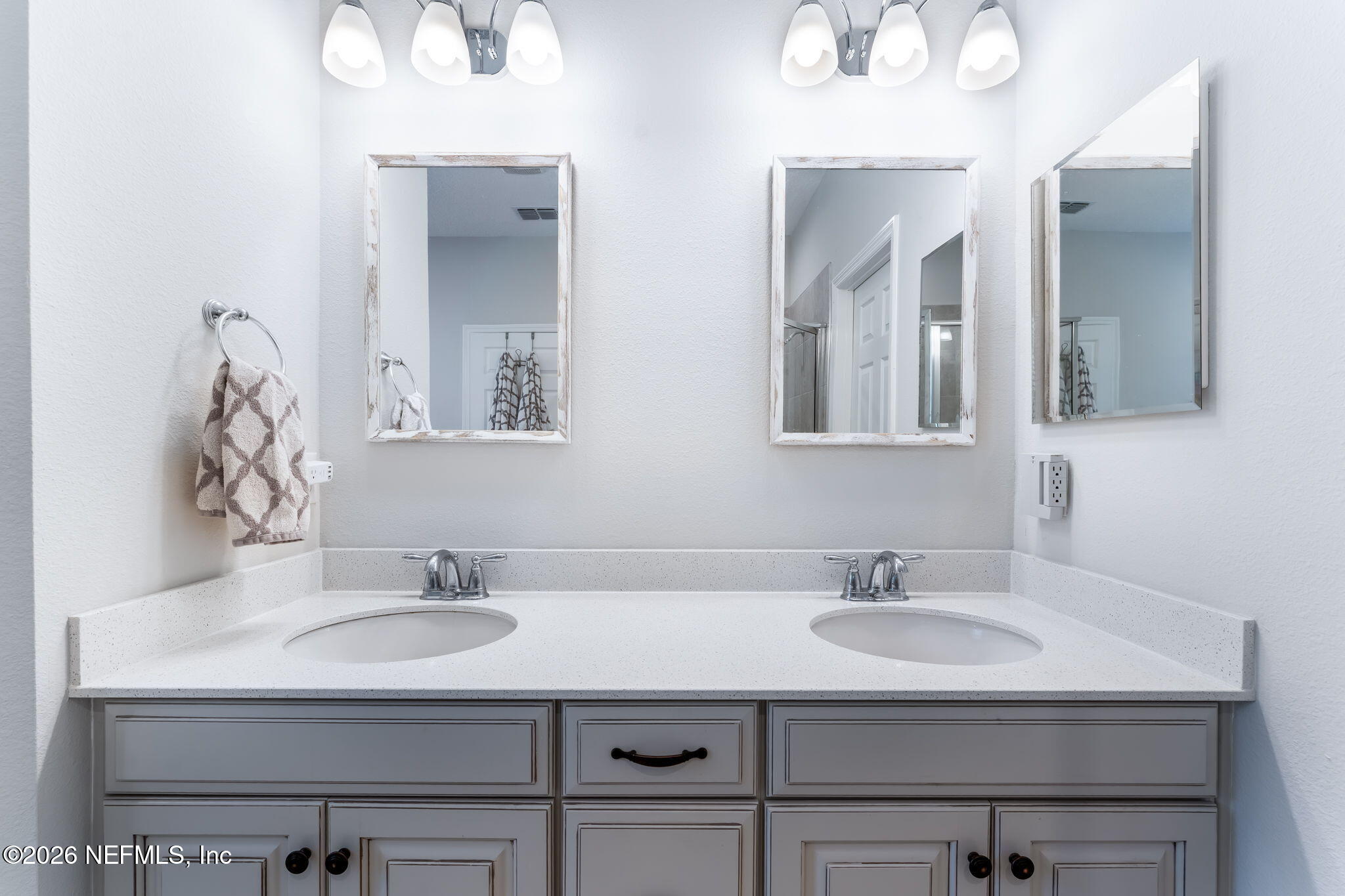 175 Convex Lane St. Augustine, FL 32095 - Photo 32 of 66 a bathroom with double sink and two mirror