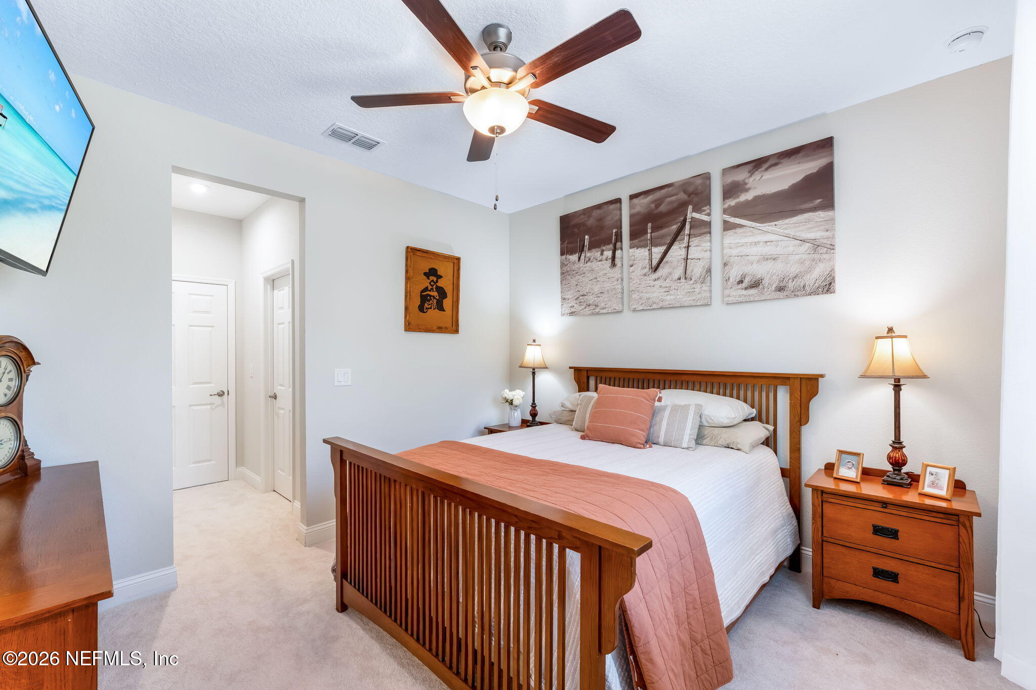 175 Convex Lane St. Augustine, FL 32095 - Photo 39 of 66 a bedroom with a bed and a chandelier