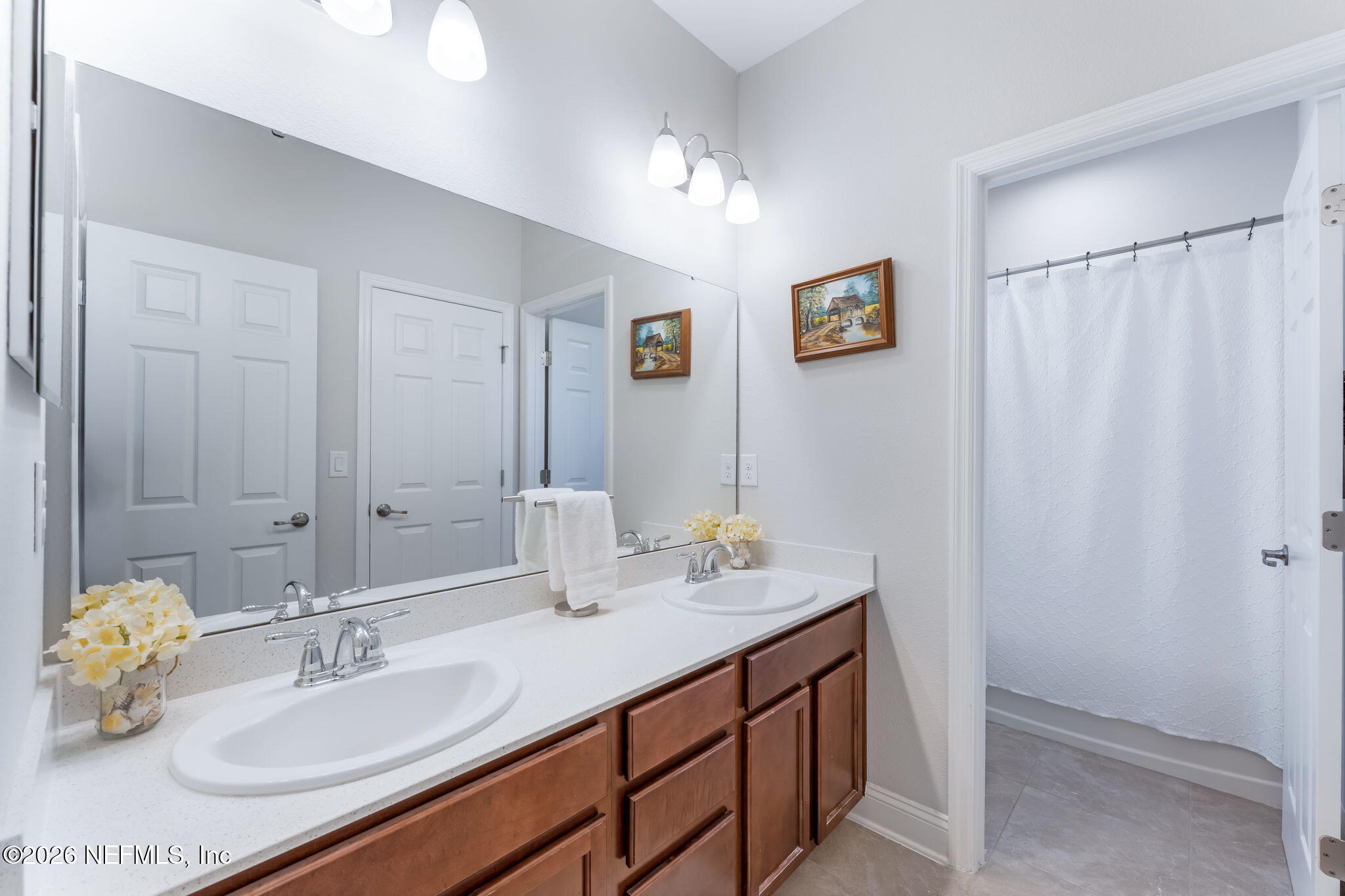 175 Convex Lane St. Augustine, FL 32095 - Photo 40 of 66 a bathroom with a sink double vanity and a mirror