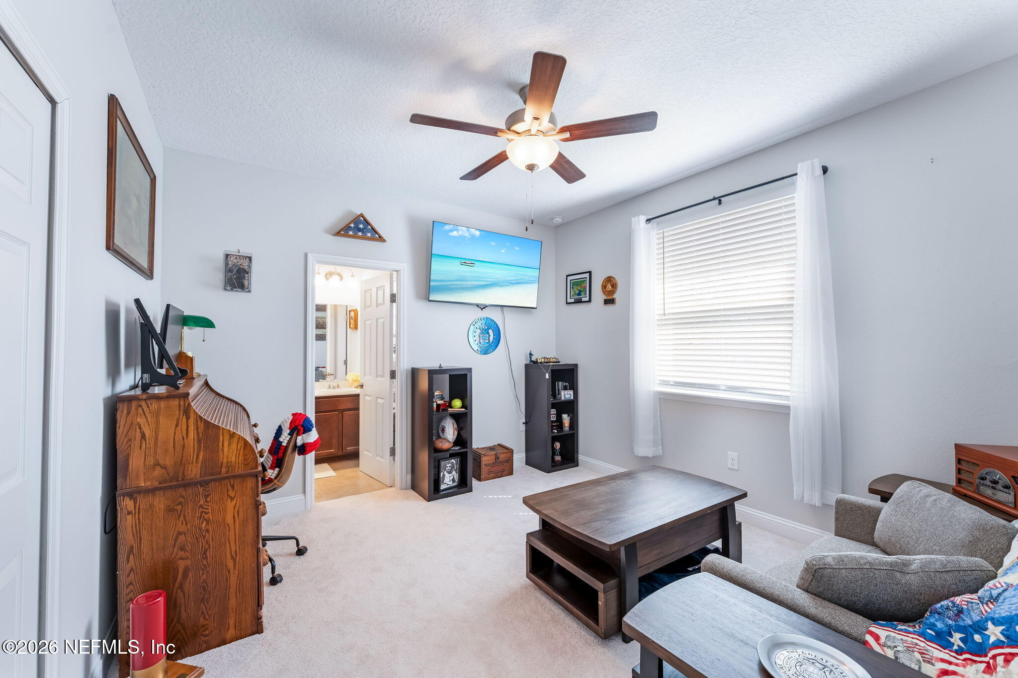 175 Convex Lane St. Augustine, FL 32095 - Photo 43 of 66 a living room with furniture and a flat screen tv