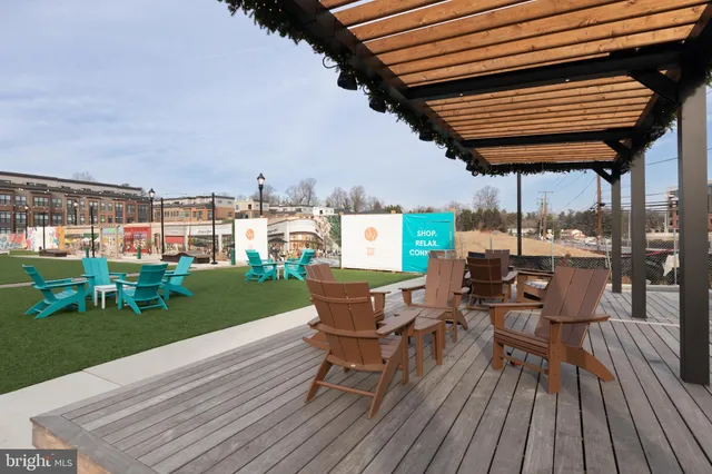 a view of a chairs and table on the wooden deck