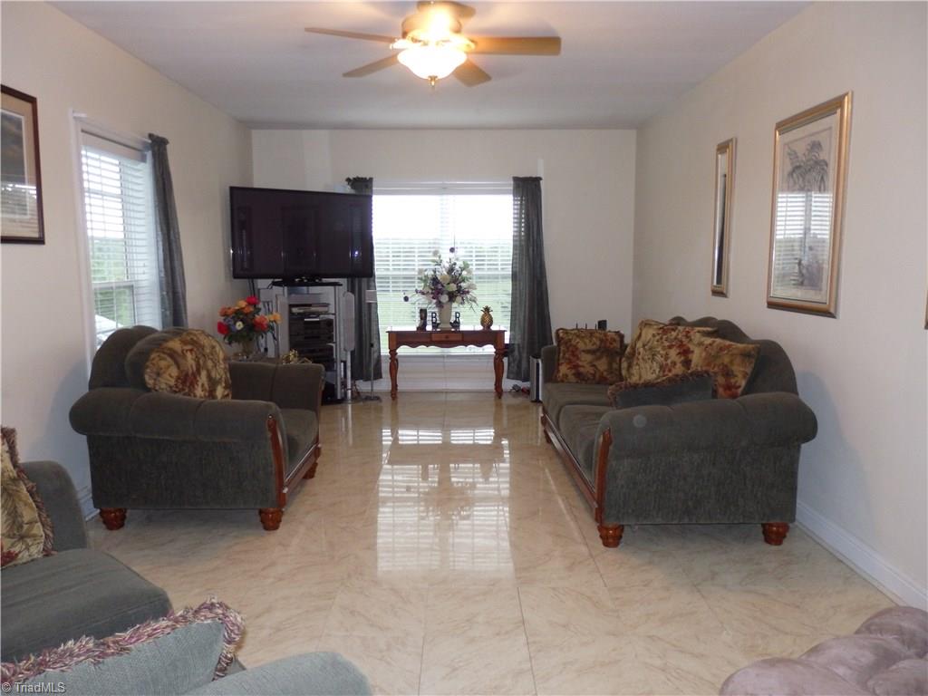 698 Wright Country Road Ramseur, NC 27316 - Photo 4 of 30 living room with tile floor