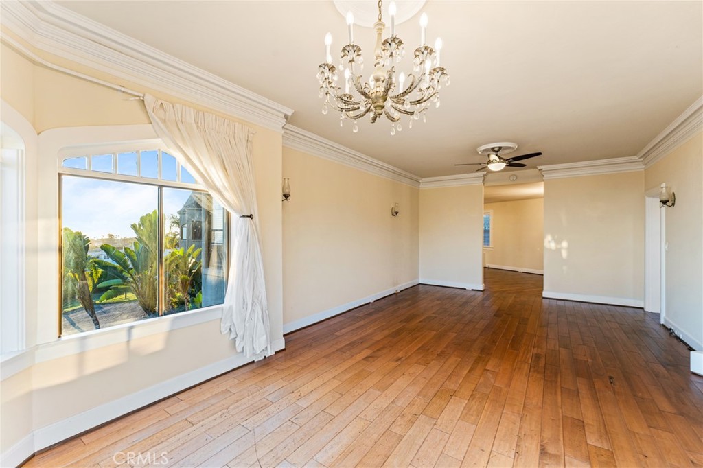 770 Hillcrest Drive, Unit 7 Laguna Beach, CA 92651 - Photo 12 of 30 wooden floor in an empty room with a window