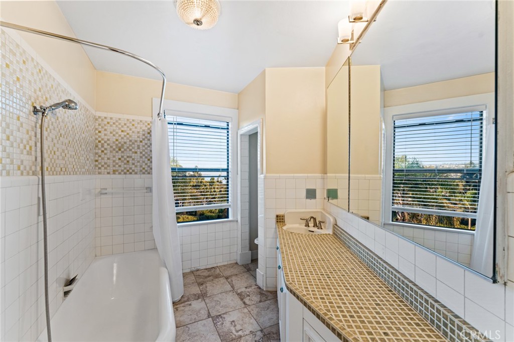 770 Hillcrest Drive, Unit 7 Laguna Beach, CA 92651 - Photo 20 of 30 a bathroom with a bathtub and a shower