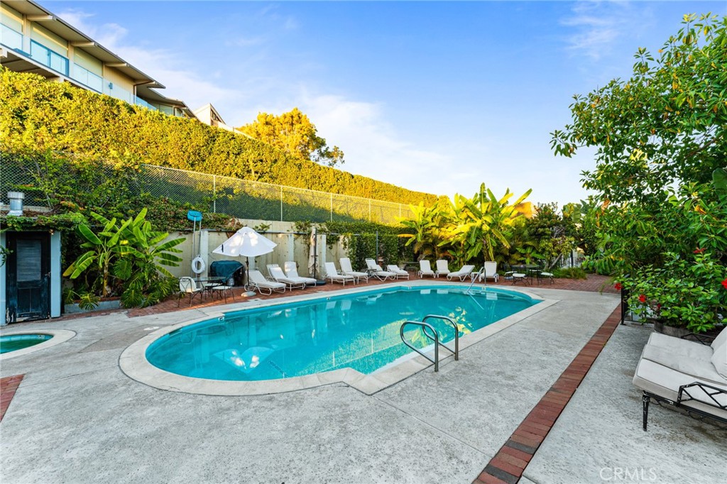 770 Hillcrest Drive, Unit 7 Laguna Beach, CA 92651 - Photo 25 of 30 a view of a swimming pool with a patio